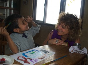 Speech Therapist Doing Art Project With Child