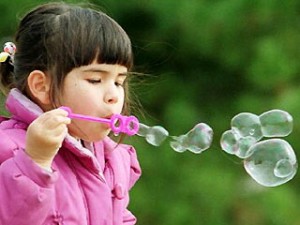 Child Blowing Bubbles