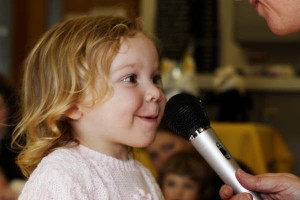 Child Singing into Microphone