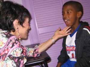 Speech Therapist Working with Child with Tongue Thrust