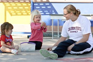 College Student Working With Children