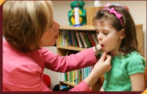 Speech Therapist Working With Child