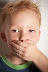Child Covering His Mouth