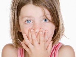 Child Covering Her Mouth