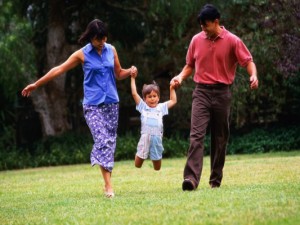 Parents Taking Child for Walk