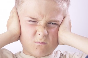 Autistic Child Covering Ears