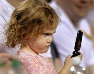 Frustrated Child Looking at the Phone