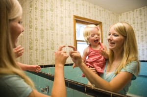 Mother Teaching Child to Make Sounds