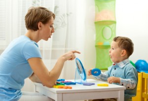Speech Therapist Working with Young Child