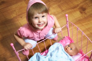 Child Playing with Doll