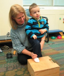 Physical Therapist Working with Child