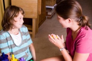 Speech Therapist Working with Autistic Child