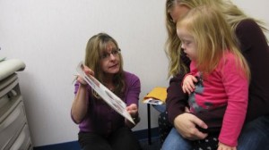 Speech Therapist Working with Child with Down Syndrome