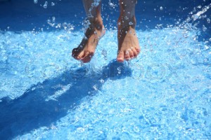 Child Swimming in Pool