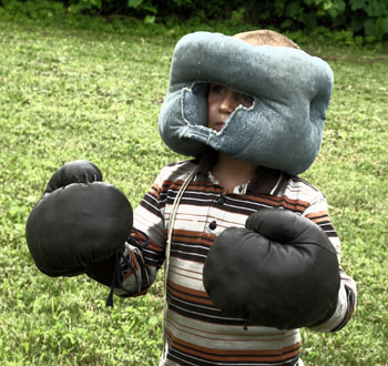 Child Wearing Boxing Equipment