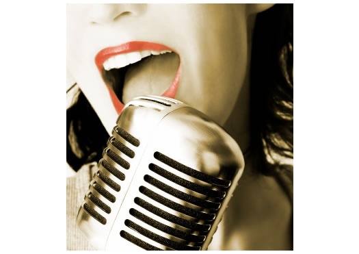 Woman Singing into Microphone