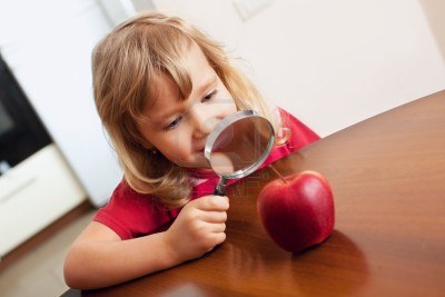 Child Using Magnifying Glass