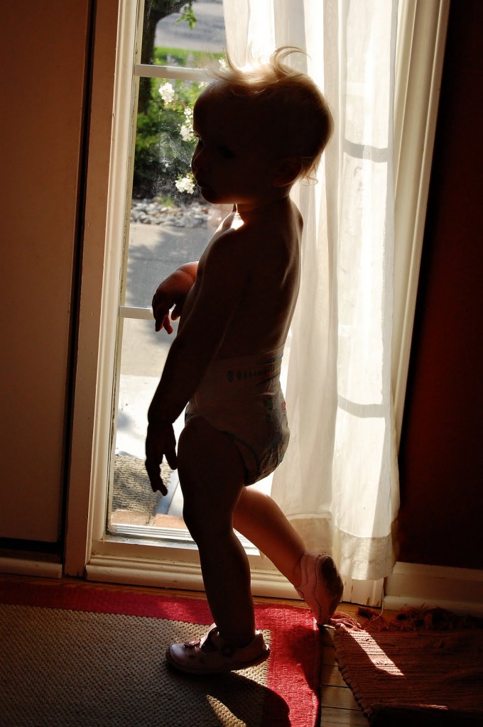 Child Silhouette Against Window