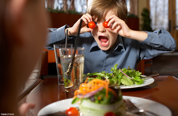 Boy with poor behavior in a restaurant