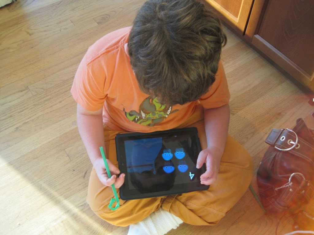 Child plays bilingual apps on the iPad