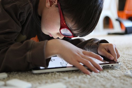 Child reads ebook on iPad