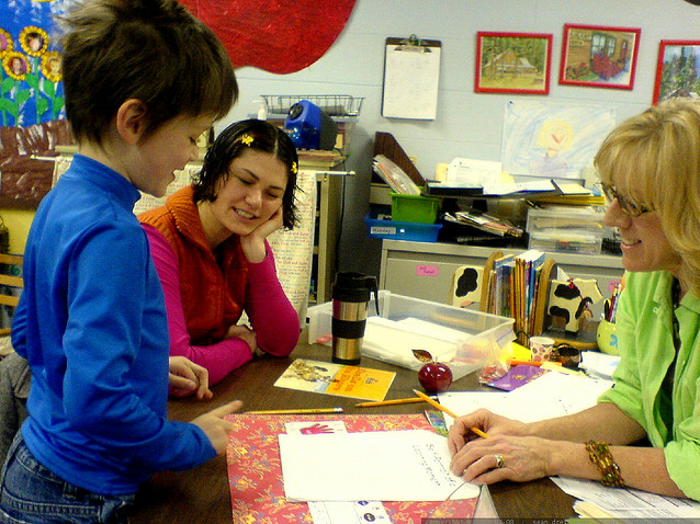 parent and teacher in conference with student