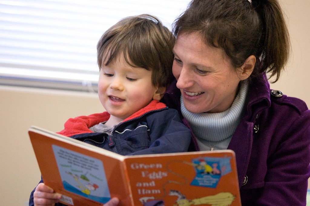 child reading with mom