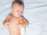 The Connection Between Baby Bottles, Trismus, TMJ, and Speech Delays