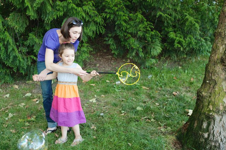 Activities such as blowing bubbles are excellent low cost speech therapy activities that you can do at home!